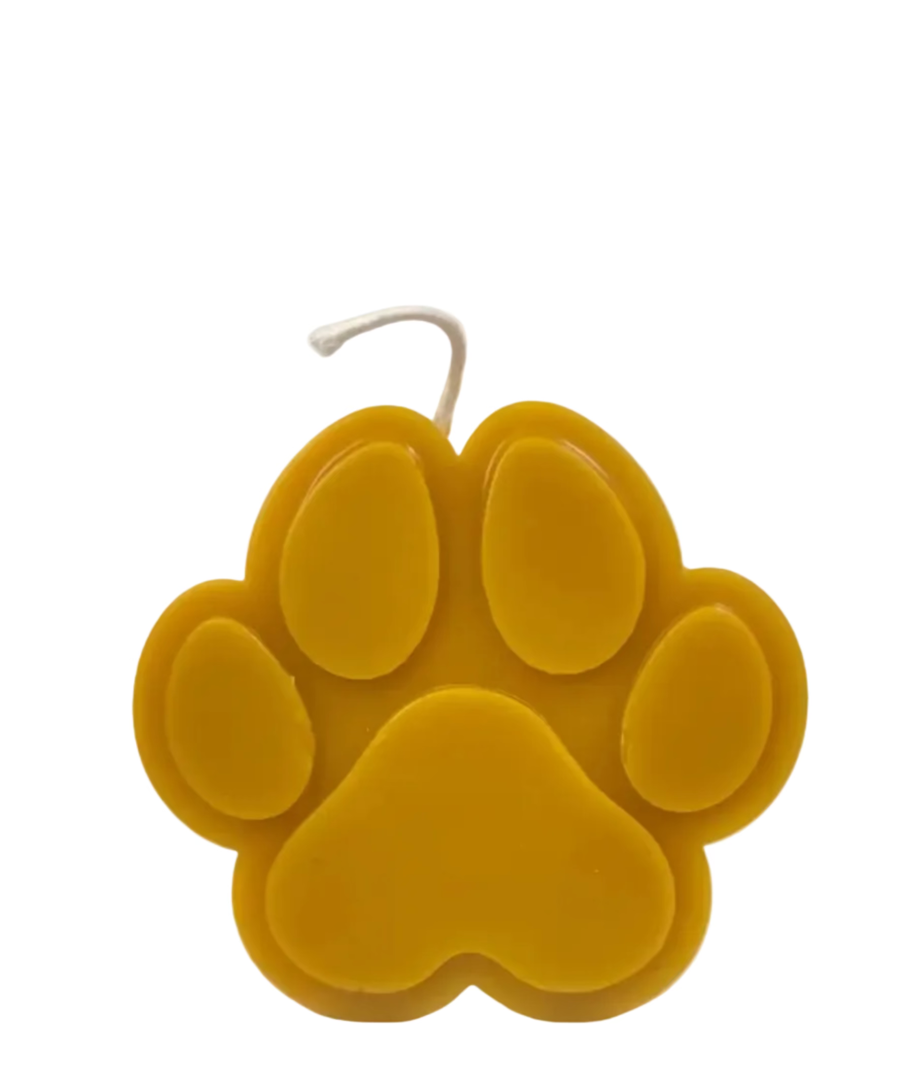 Beeswax candle shaped like a paw print on a white background